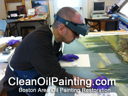 clean oil painting restoration Boston working on an oil painting restoration